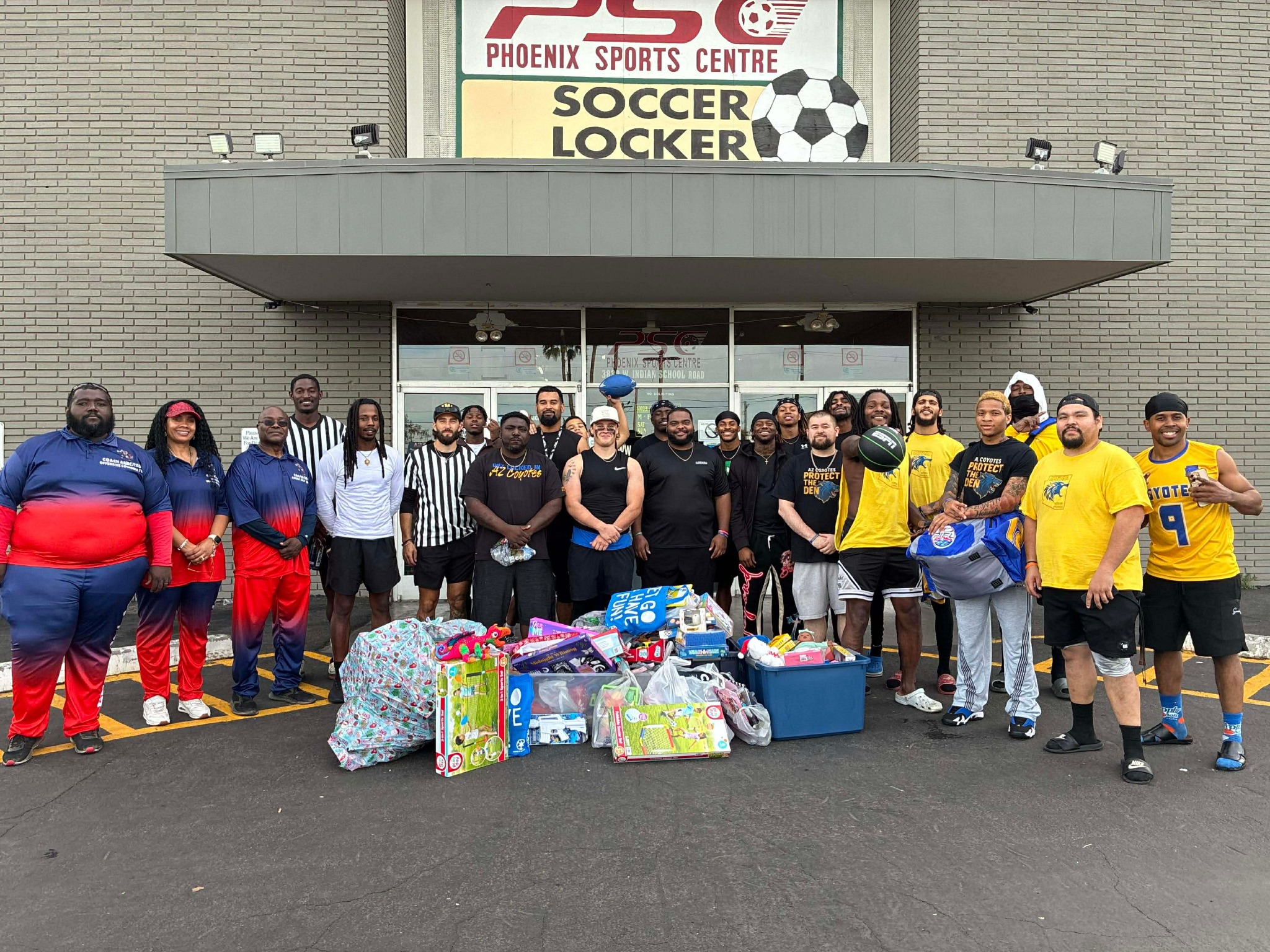 Supporters with toys collected for the Geronimo Project